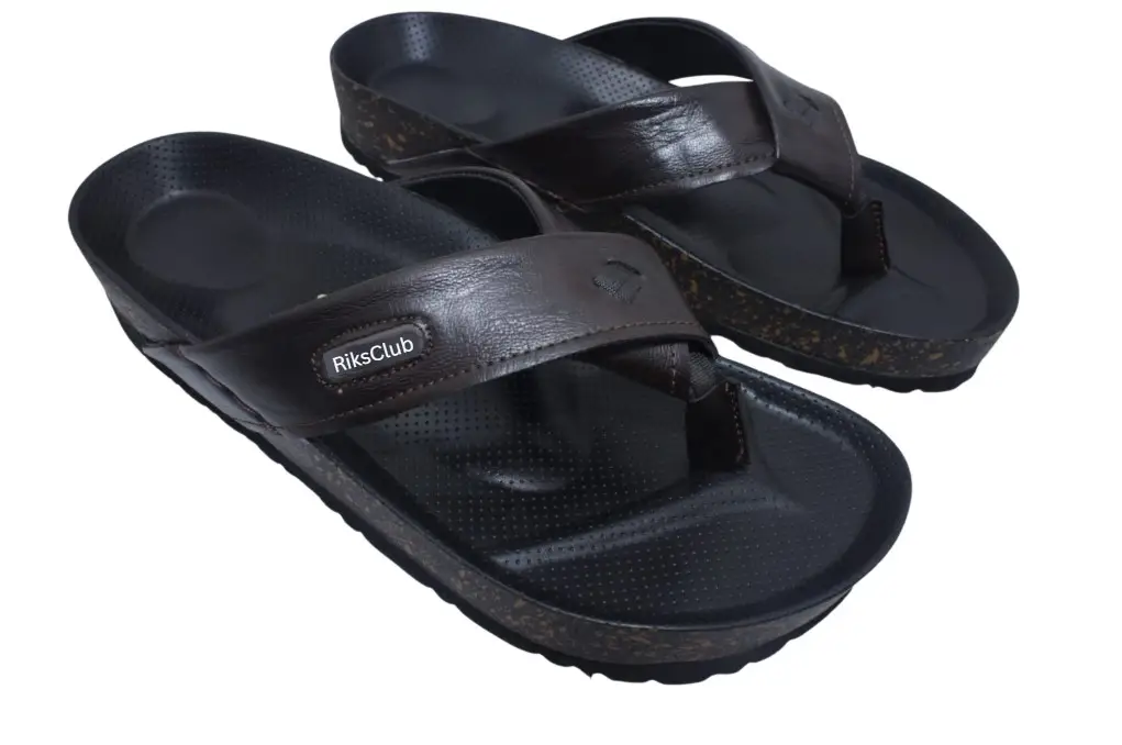 A pair of RIKSCLUB ST1120 dark brown synthetic leather thong sandals for men featuring a textured comfort sole and branded strap.
